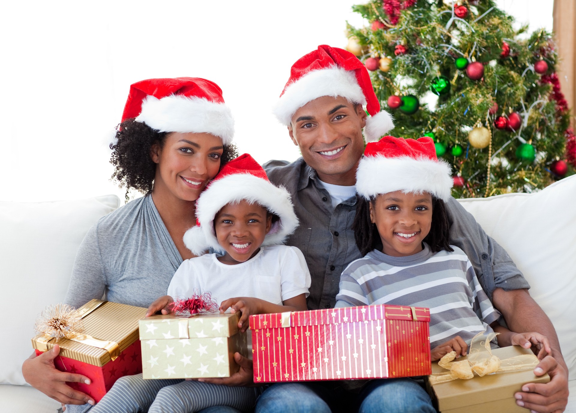 Family holding Christmas presents